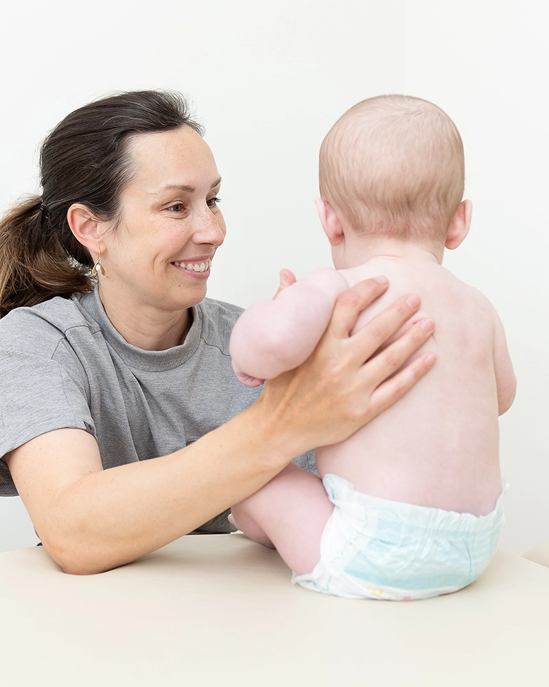 Paediatrician carrying out a Well-Baby Check