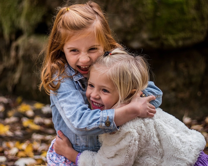 Two happy children after receiving a Well-Child Check appointment